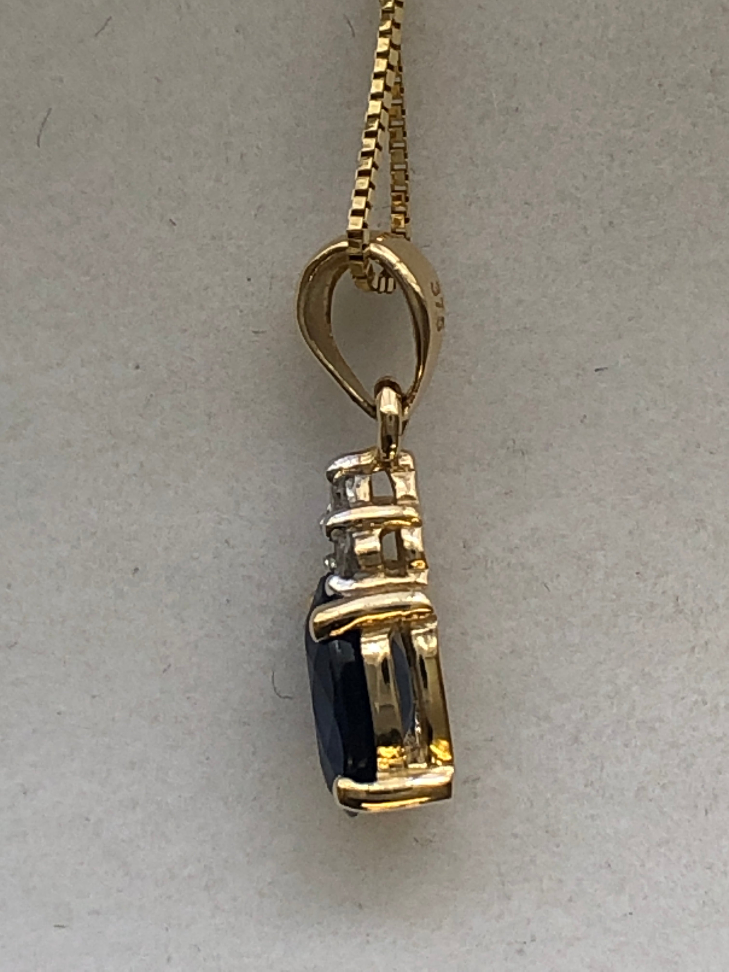 A 9ct gold sapphire and diamond pendant