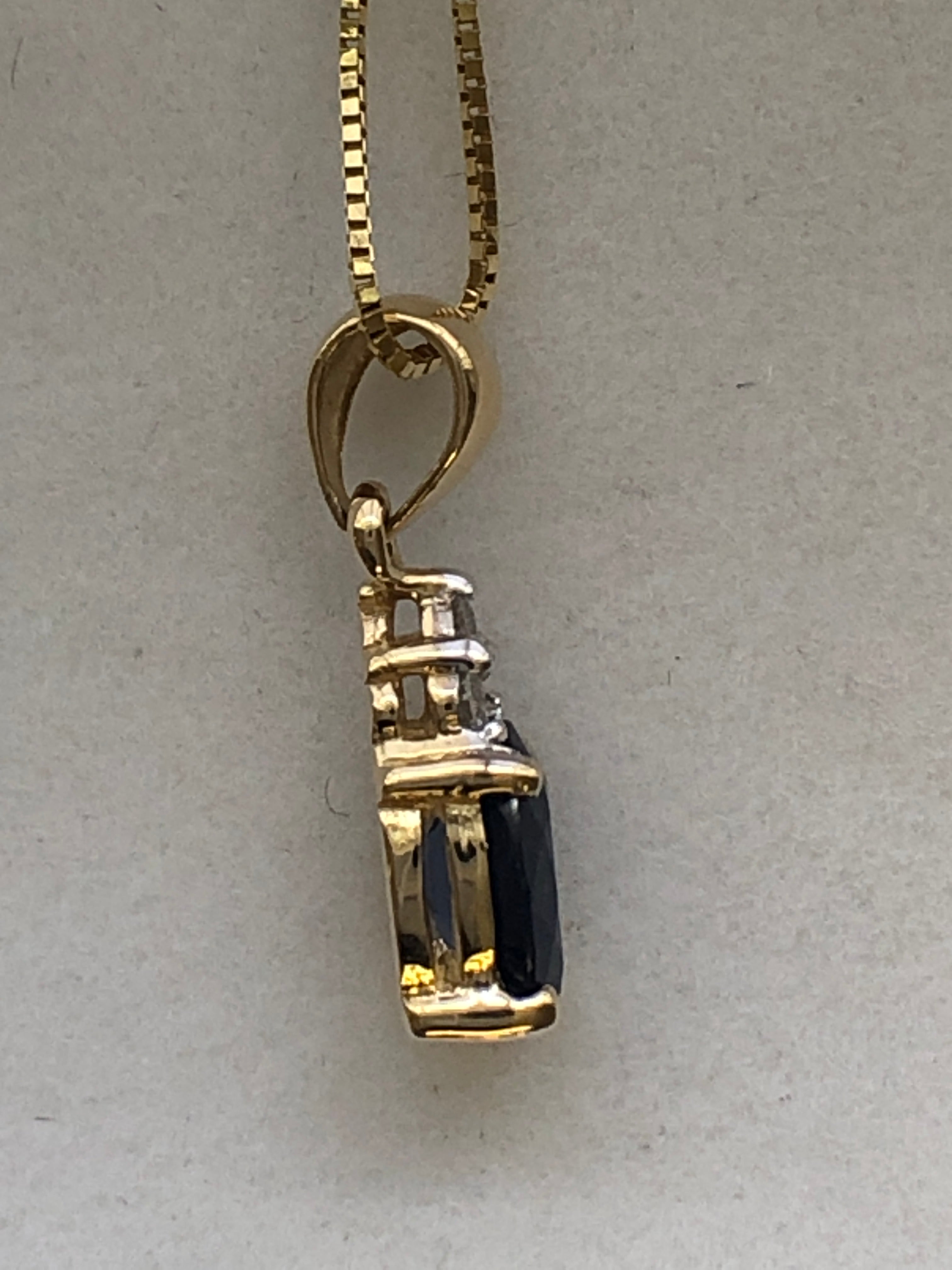 A 9ct gold sapphire and diamond pendant