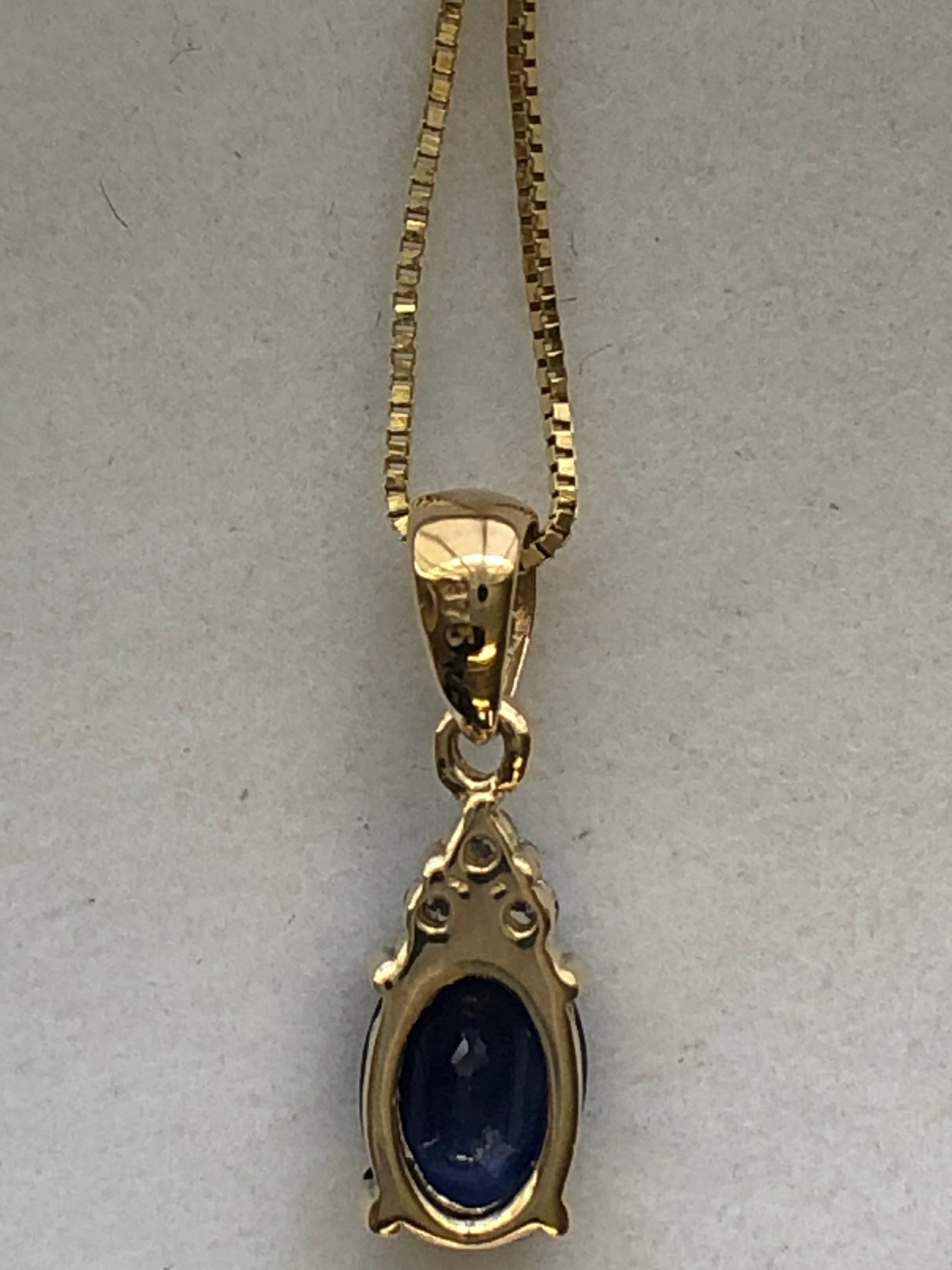 A 9ct gold sapphire and diamond pendant