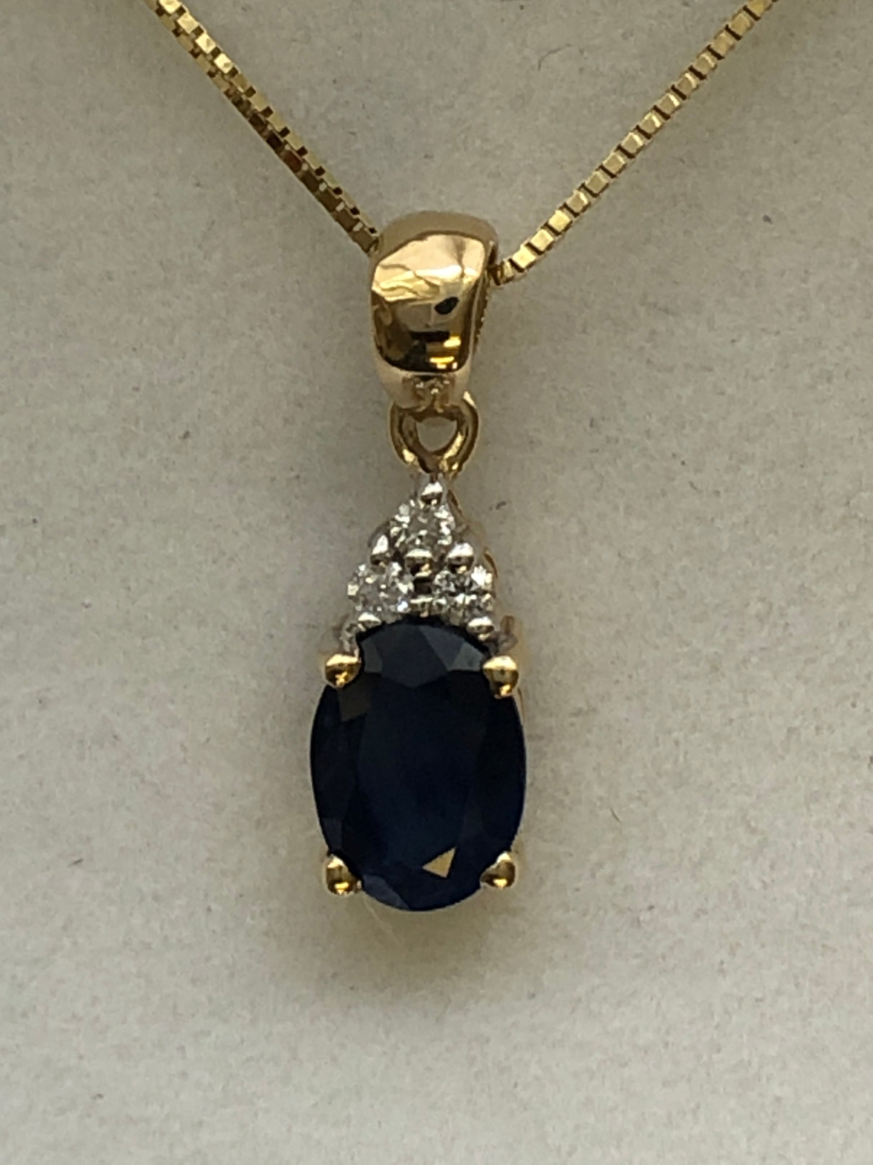 A 9ct gold sapphire and diamond pendant