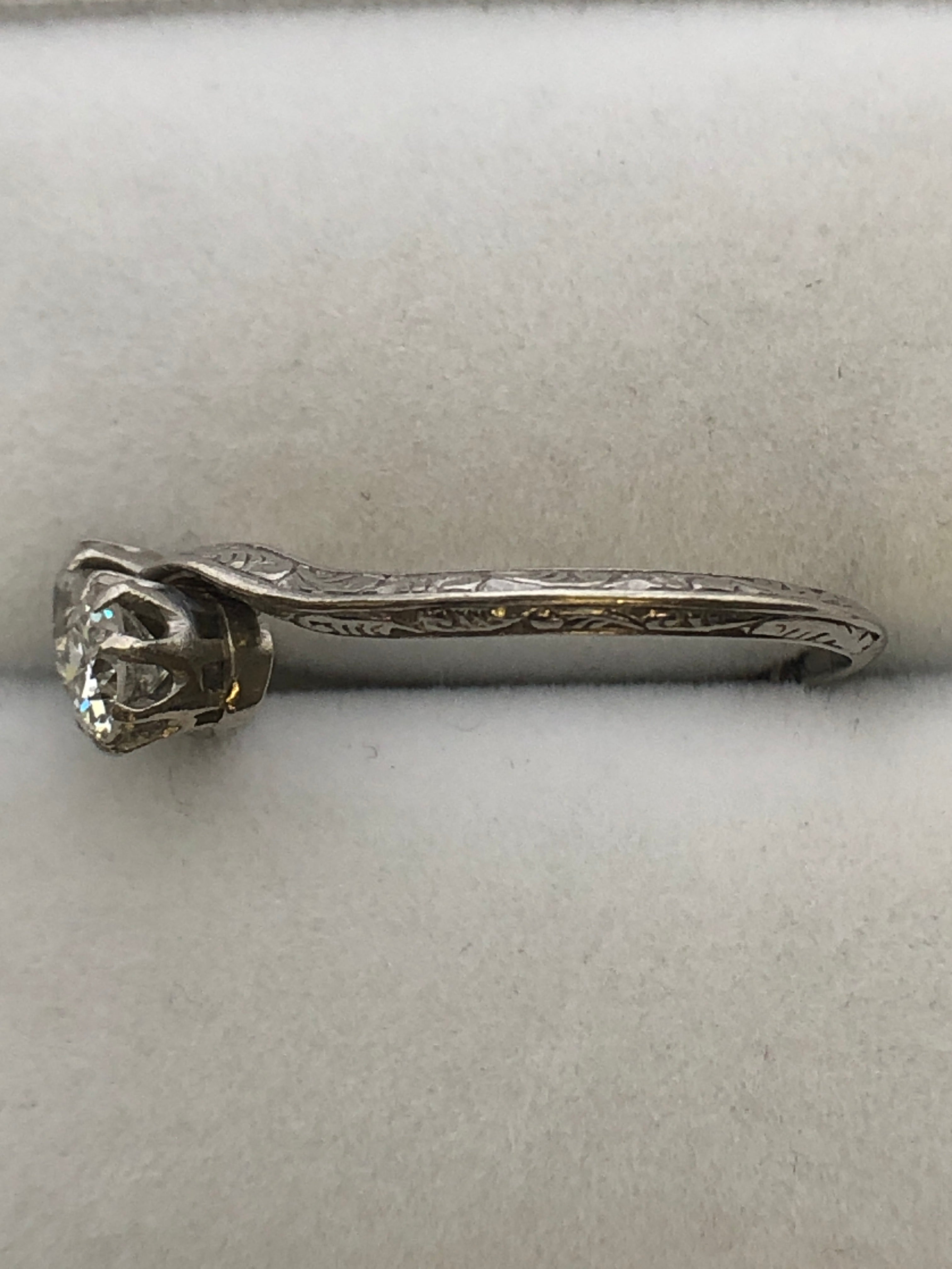 An antique platinum and diamond two stone twist ring