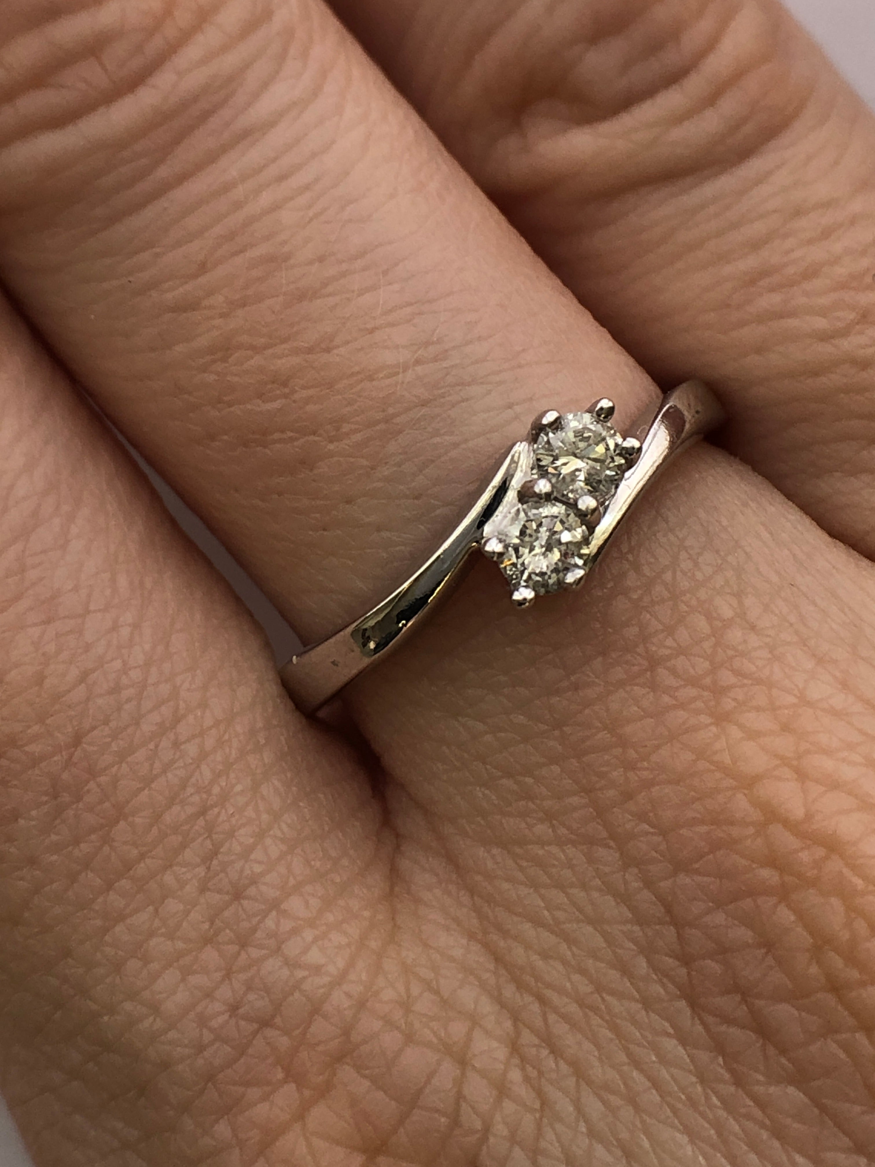 An 18ct white gold diamond two stone twist ring