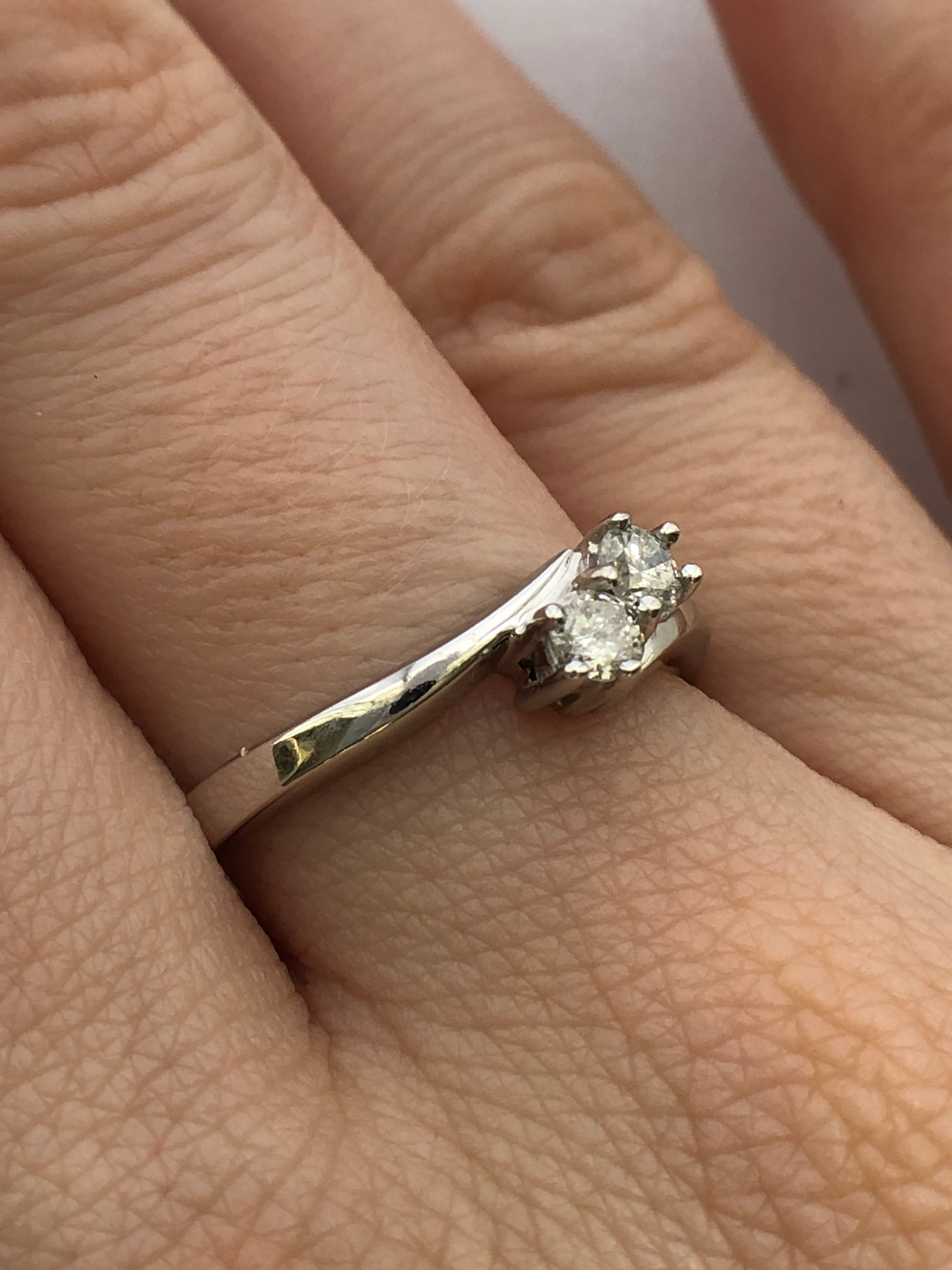 An 18ct white gold diamond two stone twist ring