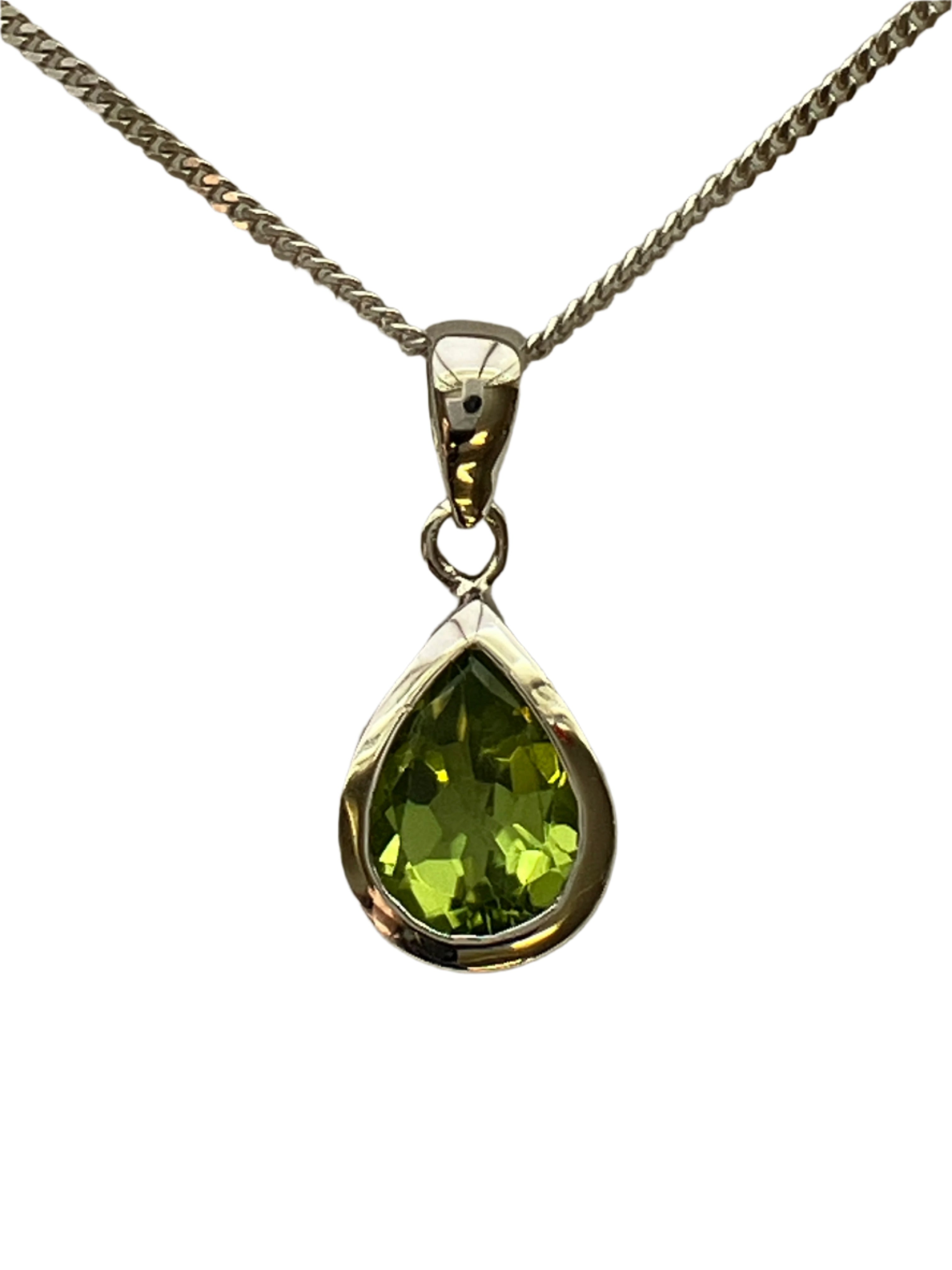 A 9ct white gold peridot pendant