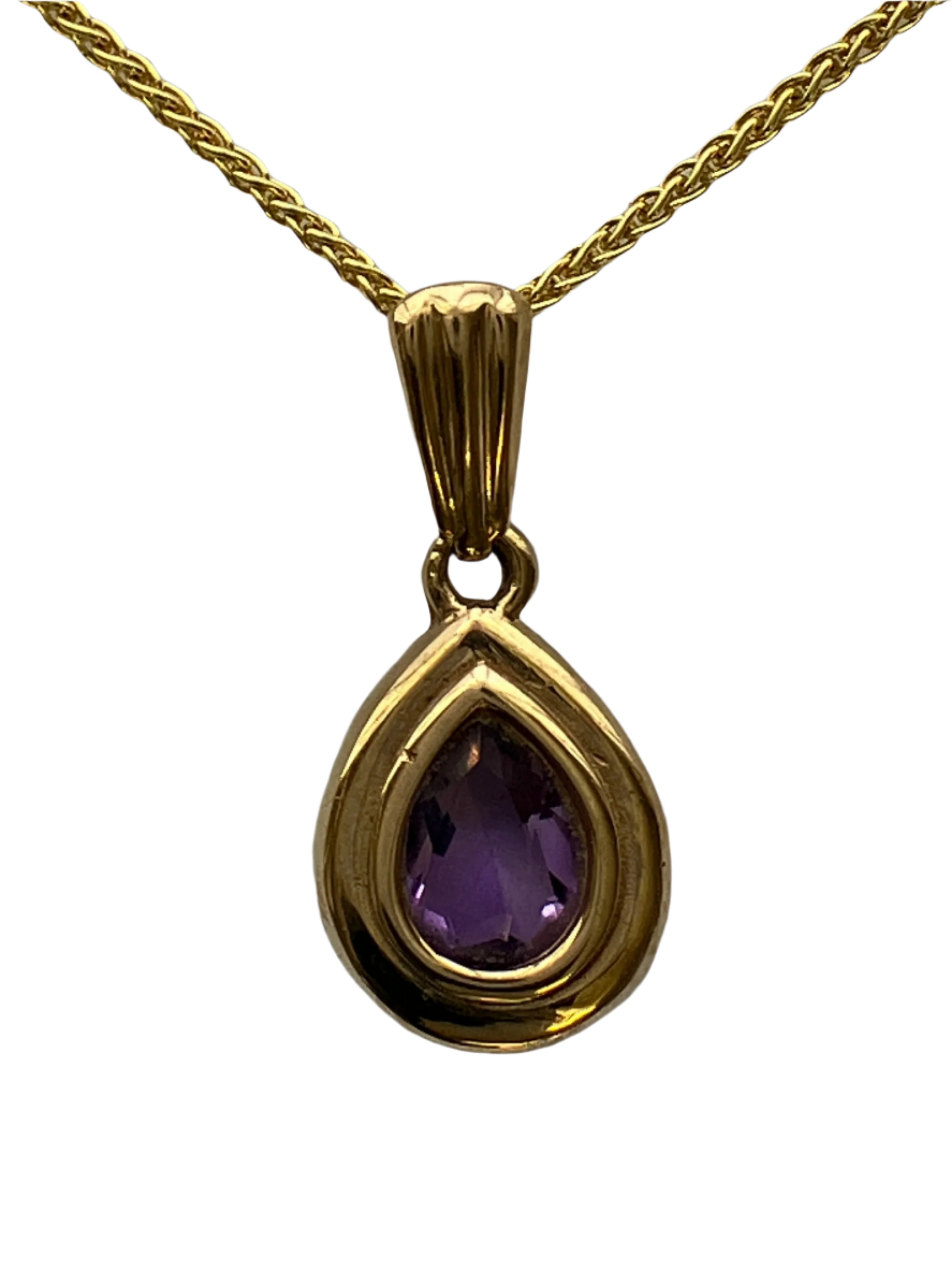 A 9ct gold amethyst pendant on a 9ct gold chain